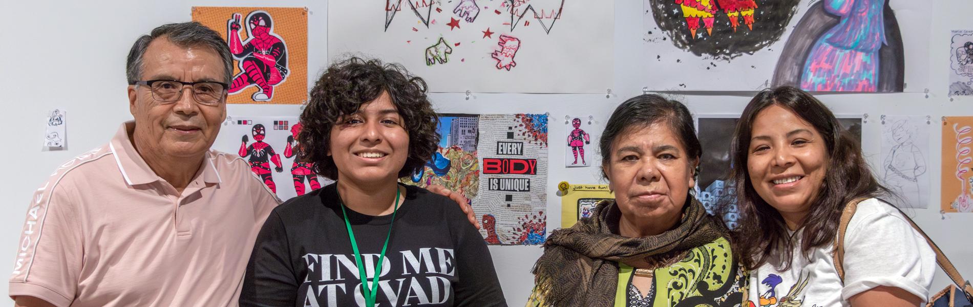 Family of Creative U students visit the Art Building to see their students' artworks.