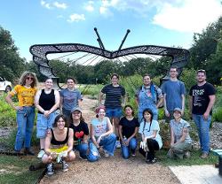 The students in the Fall 2025 Art in Public course worked with faculty and artist Brooke Thompson to install her butterfly trellis.