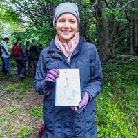 5. Rachel Black holds a sketch she created at the Magallanes Reserve.