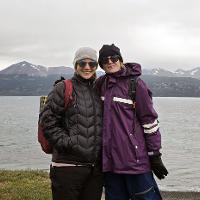 2. Rachel Black and Elaine Pawlowicz are standing in Punta Gusano, Chile. The ocean and mountains are in the background