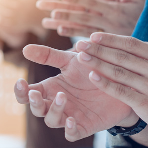 Close up of applauding hands