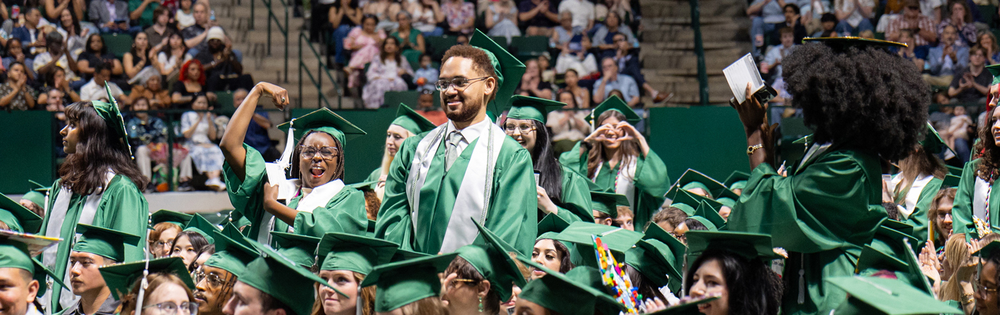 A large crowd of students in commencement regalia.