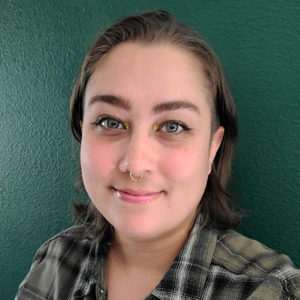 Jordan is facing forward and smiling.