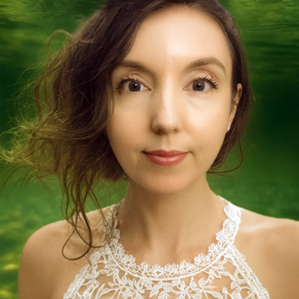 Kate is facing forward. She has brown hair.