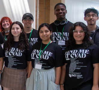 Creative U students wearing "Find me at CVAD" T-shirts