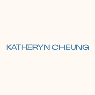 Katheryn Cheung in blue block letters on a white background.