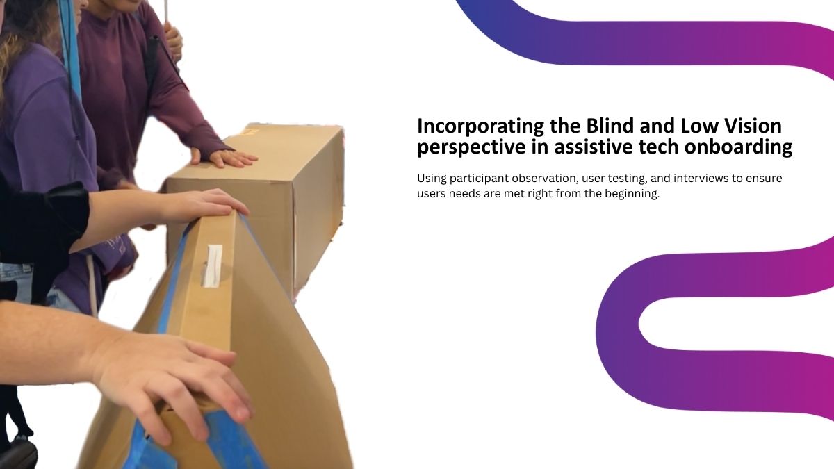 Photo of two blind individuals unboxing a rectangular prototype box.
