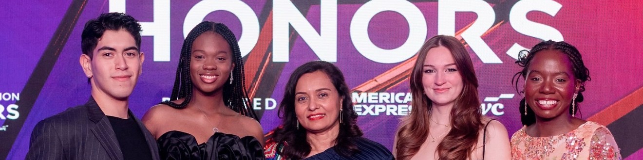 Five people facing forward and smiling