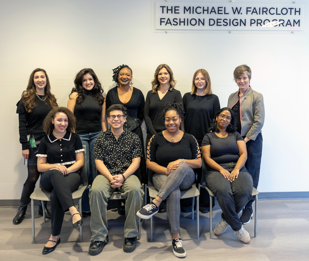 Two Fashion Design faculty posing with eight Fashion Design Student Organization members