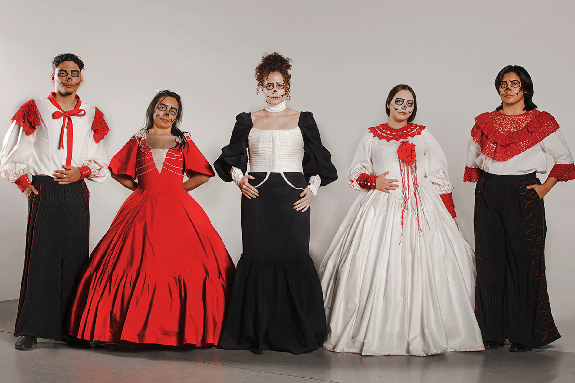 Photo of a male and four female models wearing Latinx-inspired costumes.