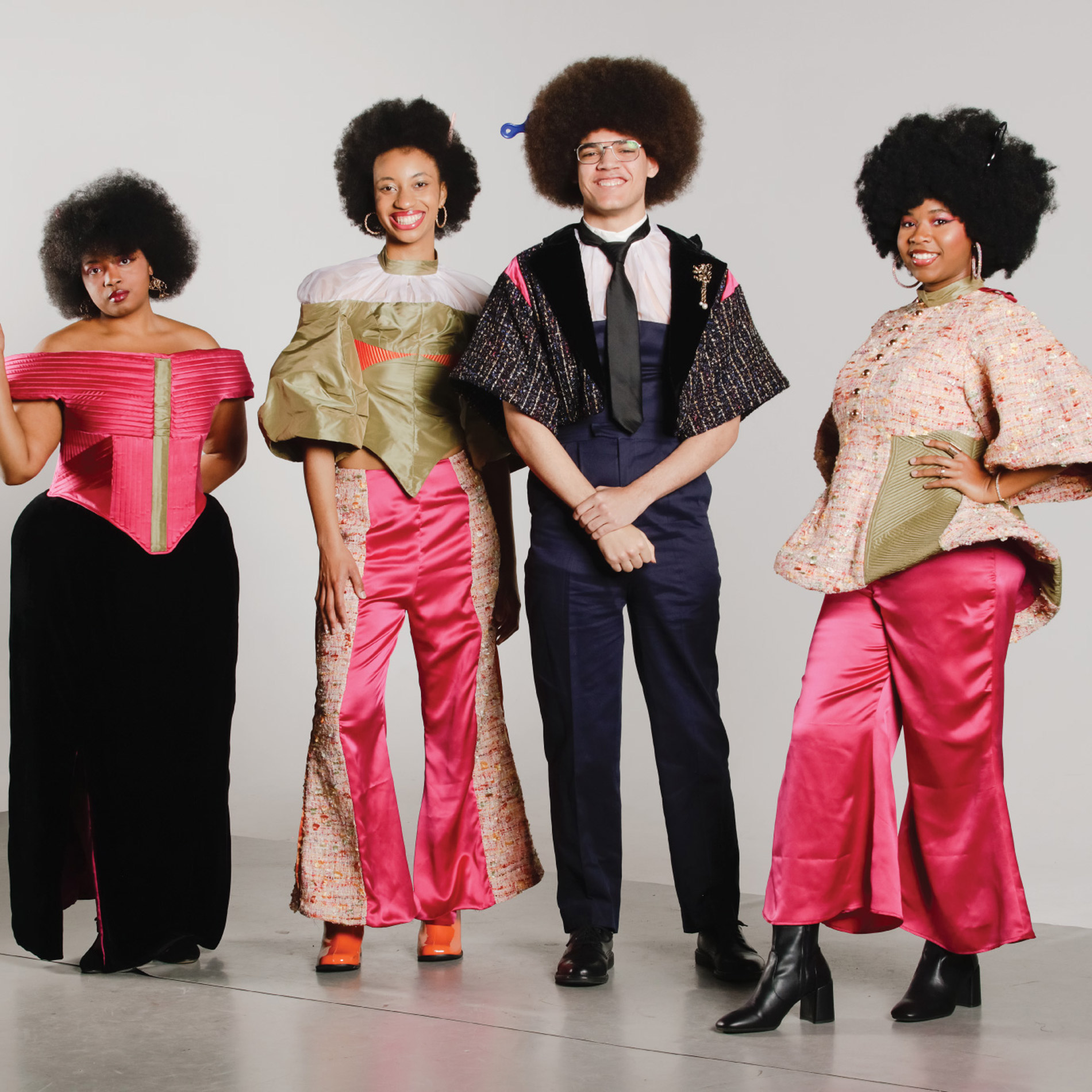 Group of 4 models, 3 women and 1 man. The colors across the collection include shades of pink, green, orange, blue, black, and white