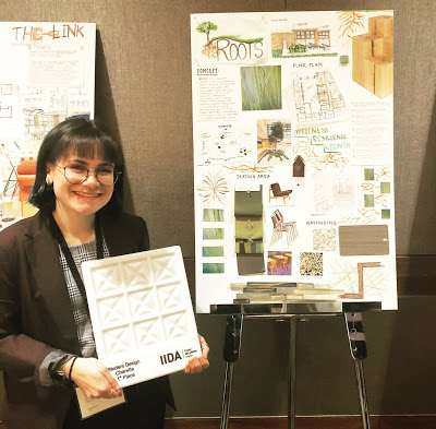 Amy New stands next to her presentation poster.
