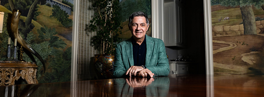 Michael Faircloth sitting at his dining room table.