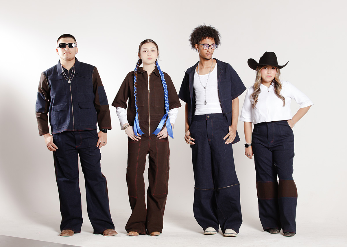 Four models wearing unisex, modular brown and blue denim outfits with detachable parts, and extra pockets for versatility, comfort, and everyday use.