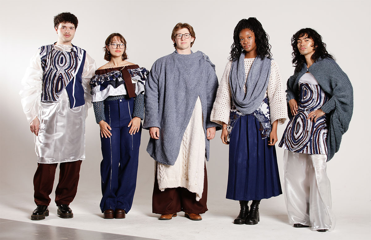 Five models wearing varying garments in blue, brown, and white while standing in front of a white background.