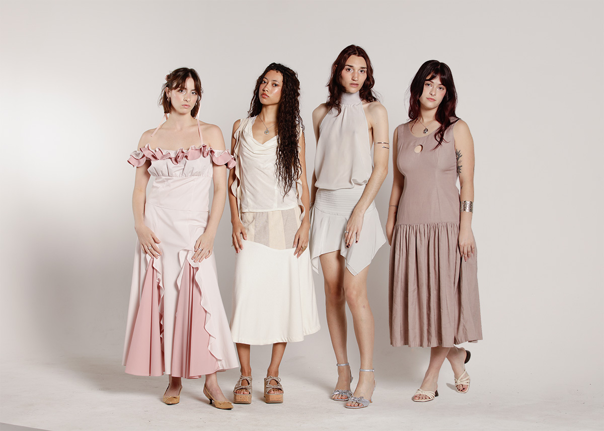  Rose Wright's senior collection "Circle of Dawn" is inspired by the purpose humans can find in nature. From L-R: A light pink top that sits off the shoulders in two layers of ruffles is paired with a floor length skirt of the same color; a cream colored low-neck cowl top with cascading ruffles that hang from the shoulders is paired with a flared midi skirt of the same color that hugs the hips before flaring out; a sheer, silvery silk halter-neck blouse is tucked into a delicately pleated skirt with an asymmetrical hem made of the same fabric; a mauve dress with a low neckline features a small circle cutout in the middle of the chest is fitted to the torso until it meets the hips, where the skirt is gathered dramatically and flows down until just above the ankles.  