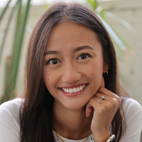 Yuleta Roeun smiling, long brown hair