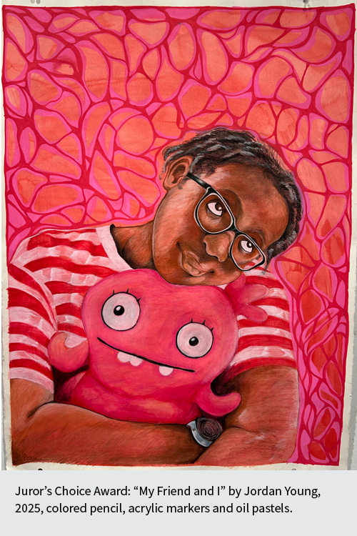 Young person wearing glasses and holding a stuffed animal