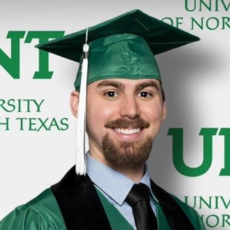 Thomas Grace is facing forward wearing his academic regalia for commencement.