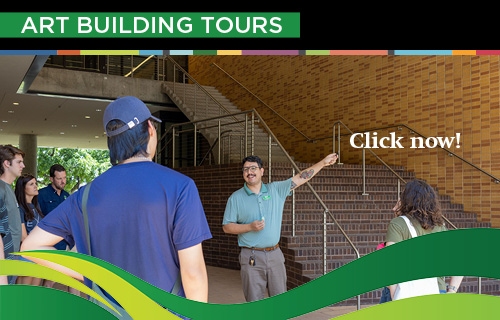 Kevin Contreras leading a tour near the grand staircase.