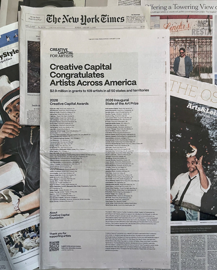 Newspapers with the Creative Capital article on the top.