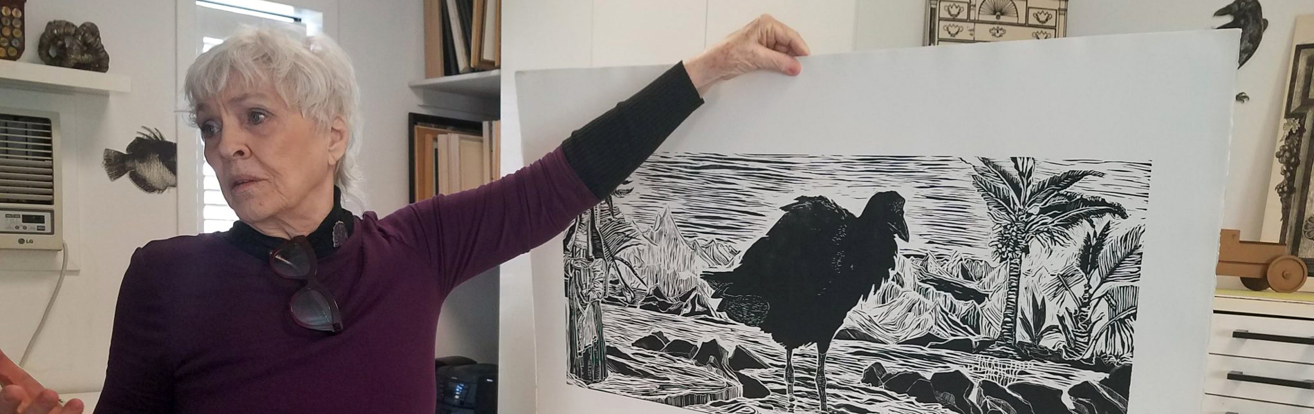 Teel Sale holding a drawing, 2020.