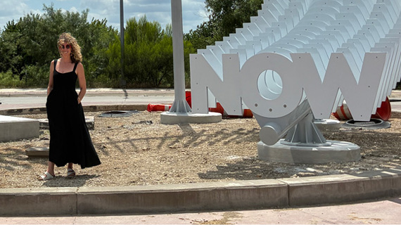 Alicia Eggert stands next to her sculpture "A Very Long Now" in Fort Worth, Texas