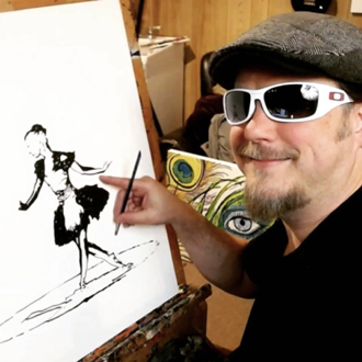 john in black shades and grey hat pointing towards his artwork 