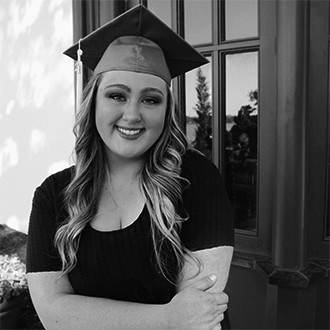 Paige Buckner wearing her graduation cap and tassel