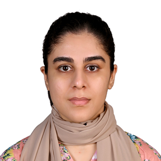 Zainab Manzoor wearing a brown scarf around her neck 