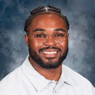 jonathan facing forward smiling, white shirt