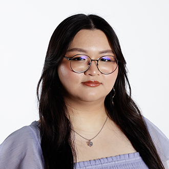 Michelle Le facing forward, wearing glasses, long dark hair, lavender-colored shirt