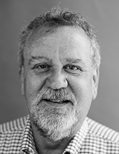 Bill Morgan, black and white photo, head and shoulders, beard, smiling