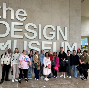 Study abroad students pose in front of the Design Museum in London.