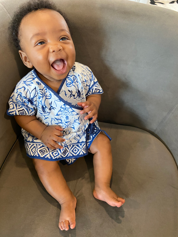 Baby wearing a blue and white batik diaper set