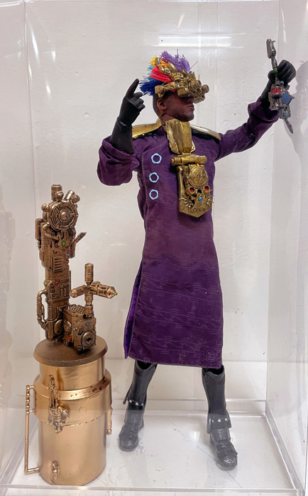A sculpture of a man in a costume with a headdress