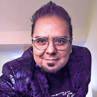 Angel facing forward smiling, wearing glasses, purple jacket, short purple hair