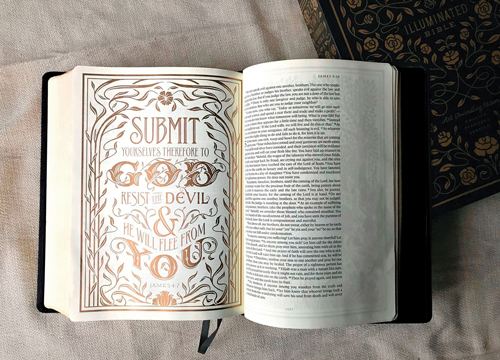 Book open to a page with elegant and fanciful typography