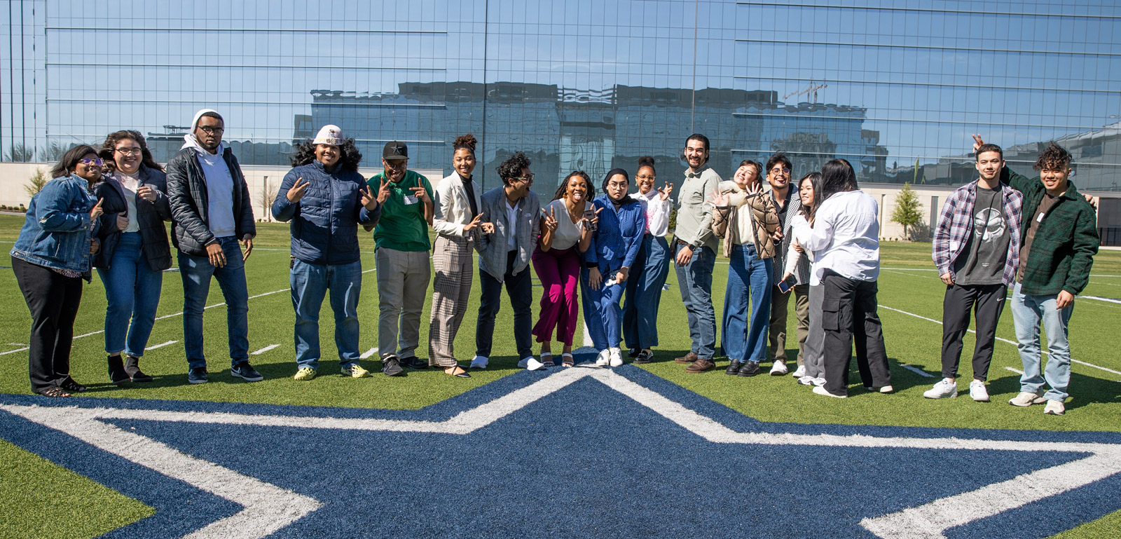 Students line up on the Dallas Cowboys star