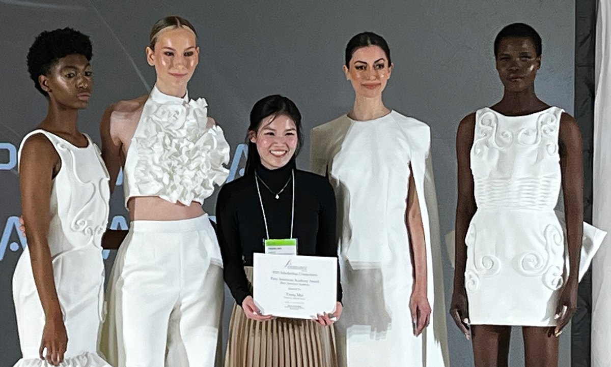 Fashion designer Trang Mai with four models.