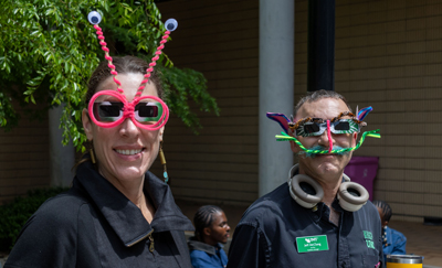 Karen Hutzel and Jeff McClung wearing decorated safety goggles for the solar eclipse.