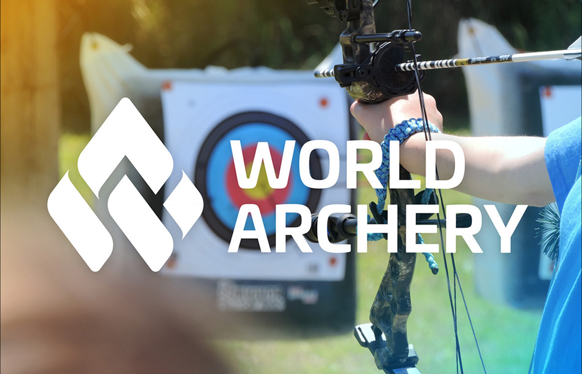 The World Archery logo over a blurred image