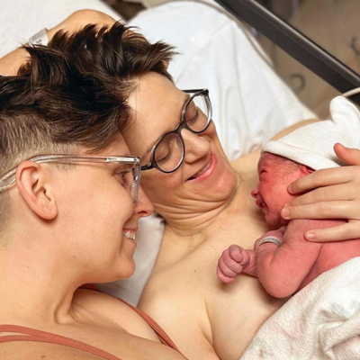 Two parents bedside after the birth of their new baby