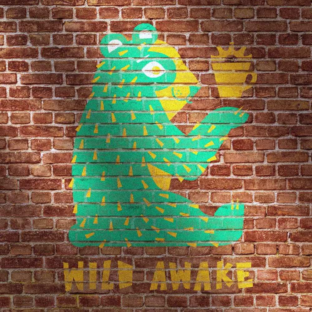 Green bear painted on a brown brick wall, Wild Awake