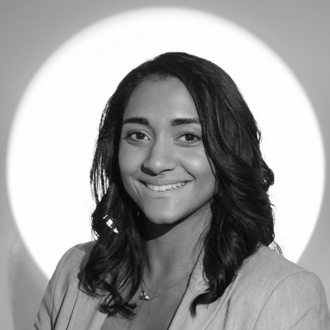 Michelle Mathew facing forward, smiling, long dark hair