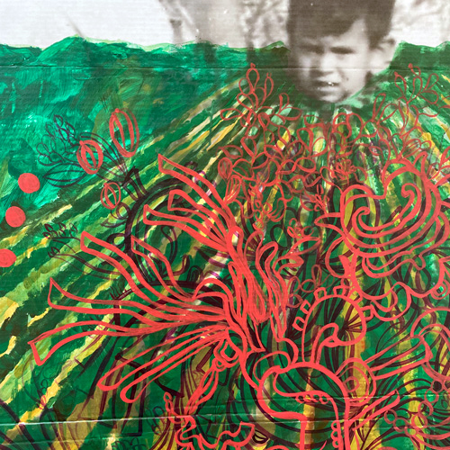 Detail of the exhibit titled "They didn't know we were seeds," closeup of the child's head in front of the green farm field