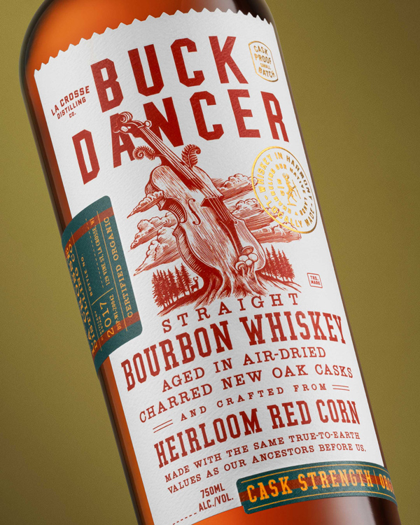 Buck Dancer: Close up bottle photo of front label depicting a violin growing from the forest floor. 