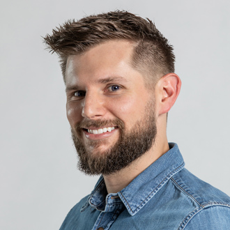 Chad Michael smiling, short brown hair, denim shirt