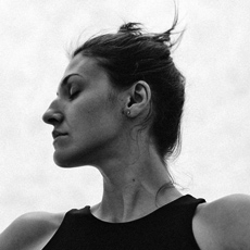 Poli Nemkova in profile, black-and-white portrait, eyes closed