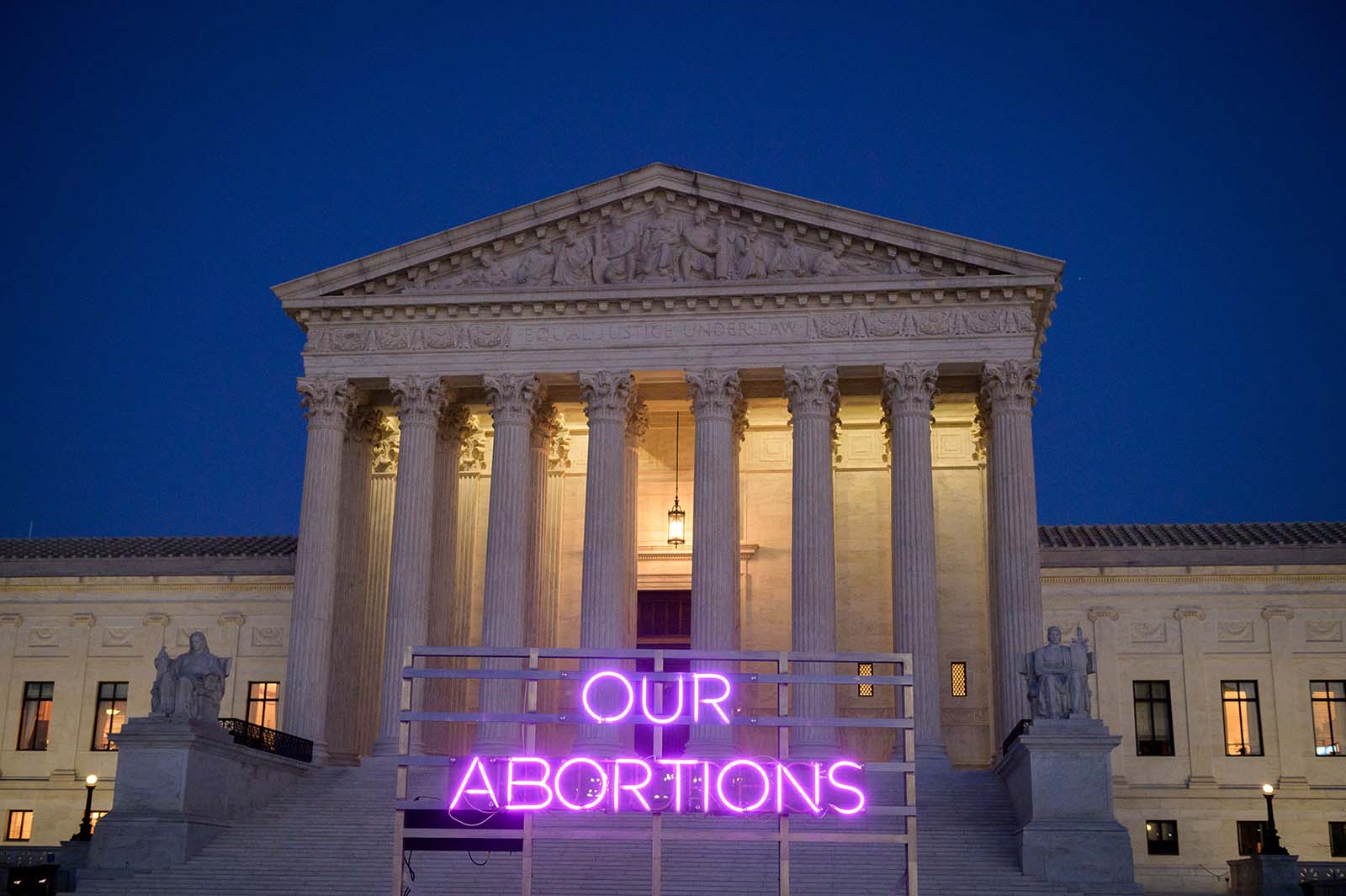 Animated neon sign that says "Our Abortions"